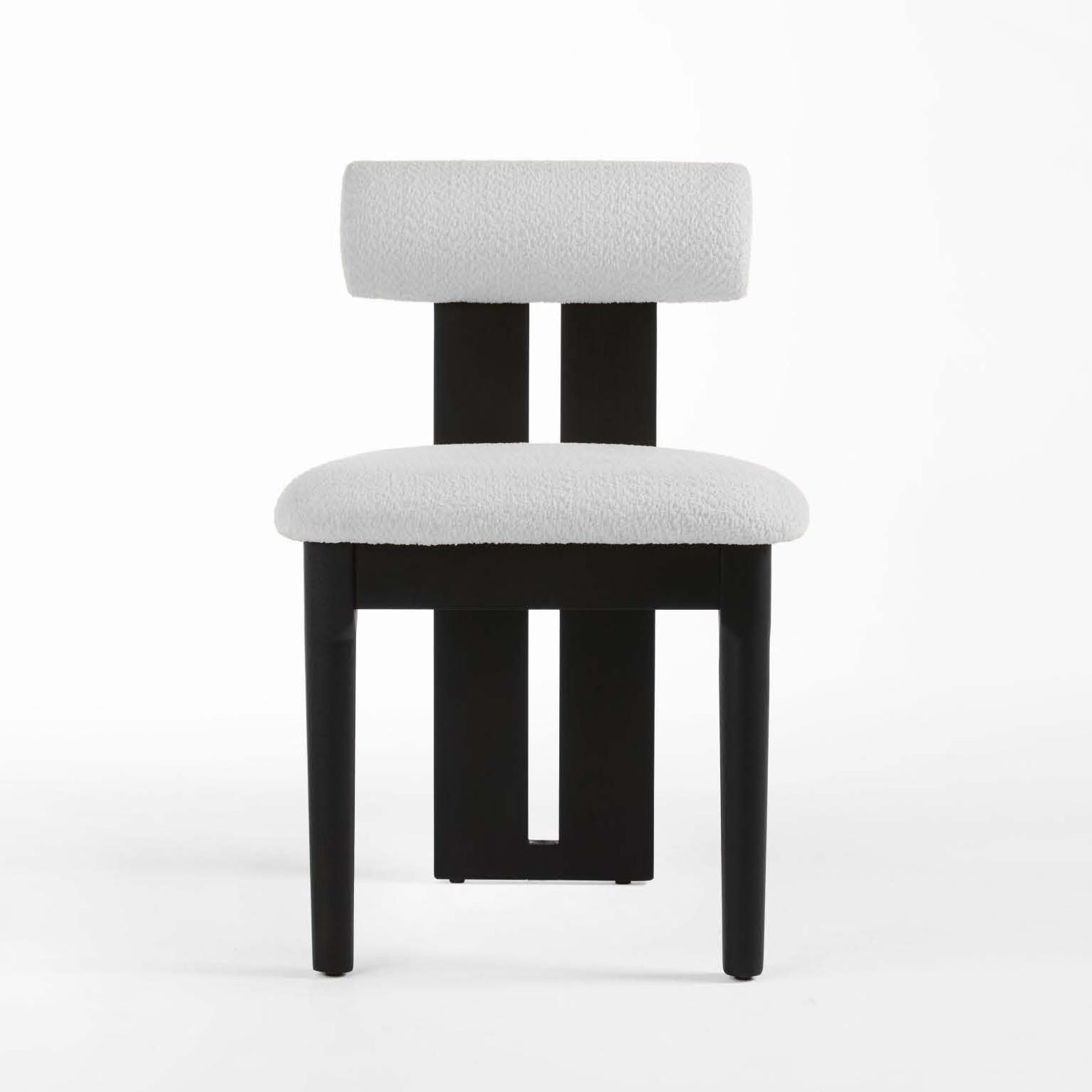 Chair with black frame and white cushioned seat and backrest on a white background