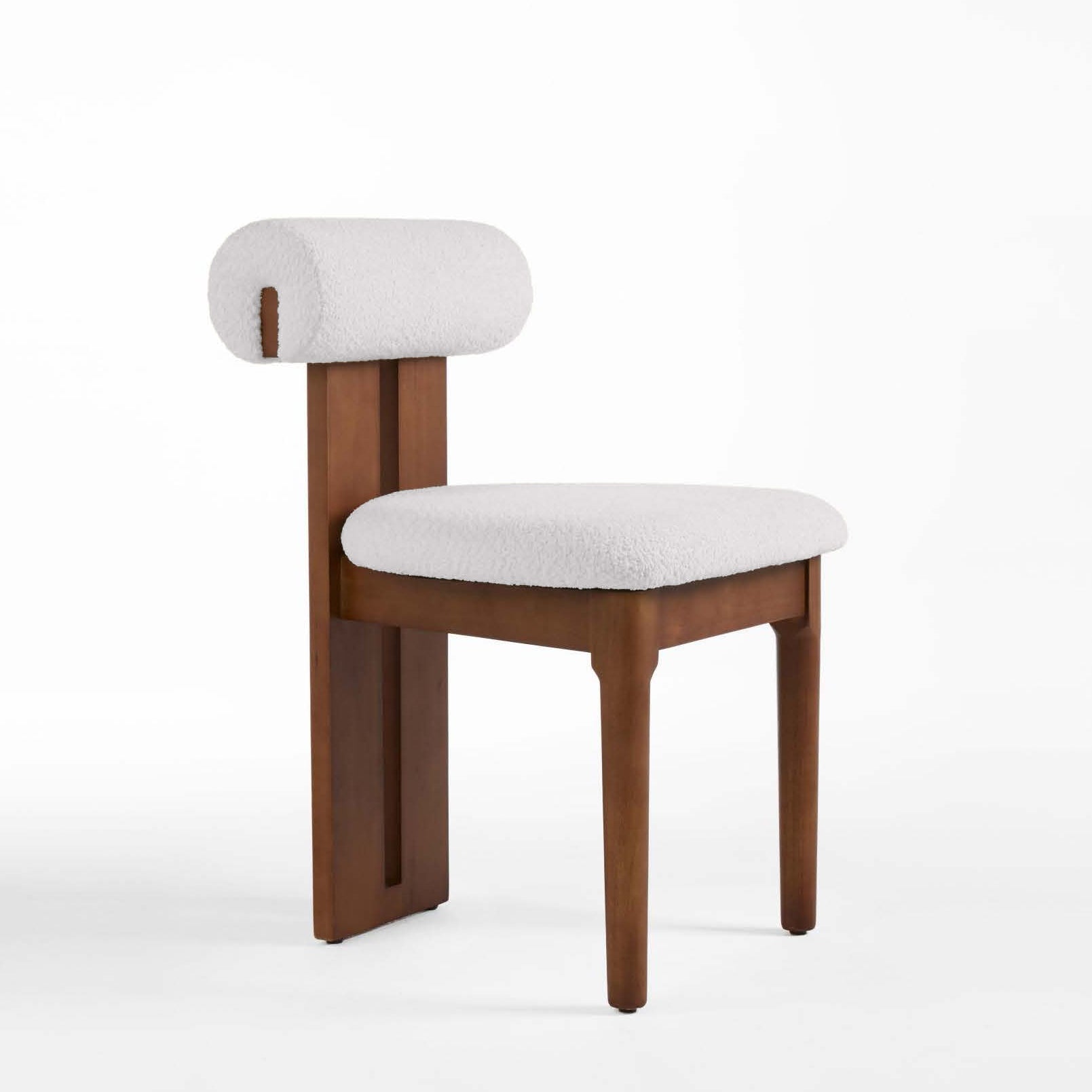 Chair with wooden frame and white cushion on a white background
