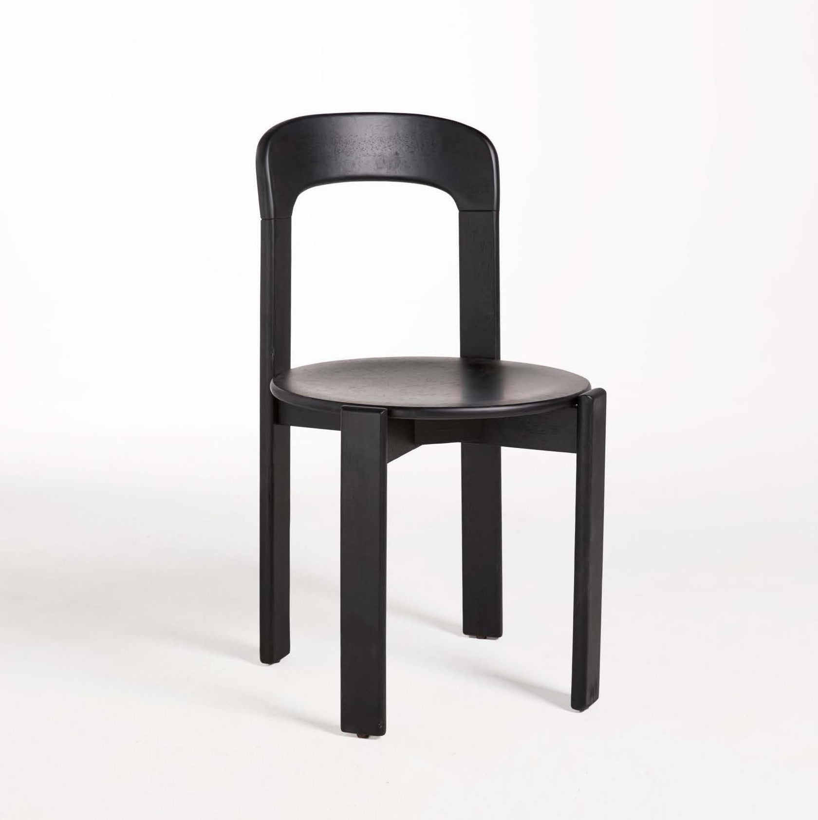A brown dining chair made of solid rubber wood, with a simple design featuring a full back and seat without any additional padding.