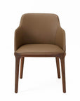 A brown dining chair with a faux leather upholstery and solid ash wood frame.