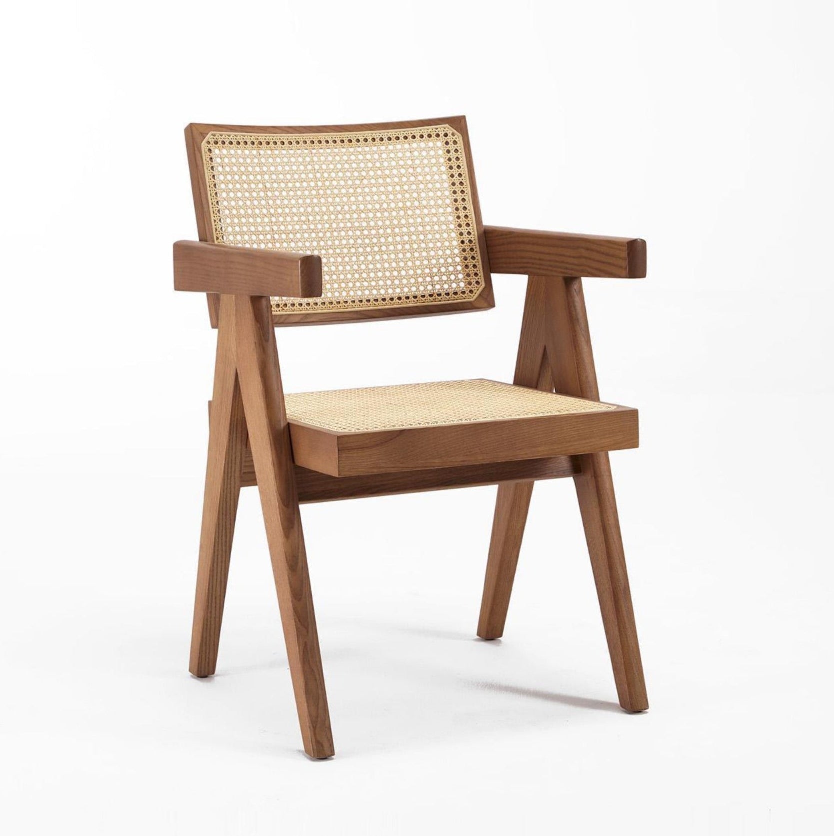 A dining chair with a solid ash wood frame  with armrest and seat in rattan