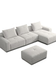 Cream white sectional sofa with ottoman on a white background