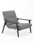 A gray upholstered Wilo armchair with a solid ash wood frame and seat cushion.