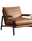 Brown leather armchair with metal legs
