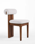 Chair with wooden frame and white cushion on a white background