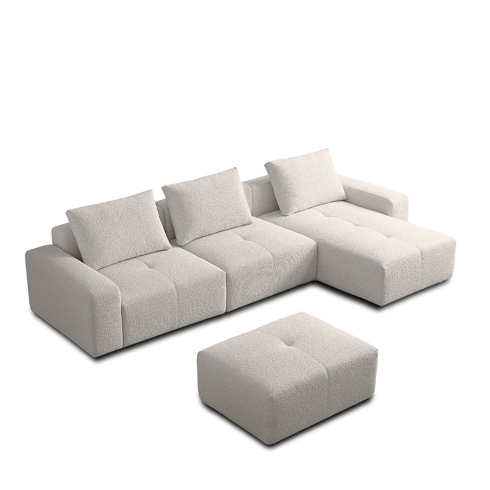 cream white sectional sofa with ottoman on a white background